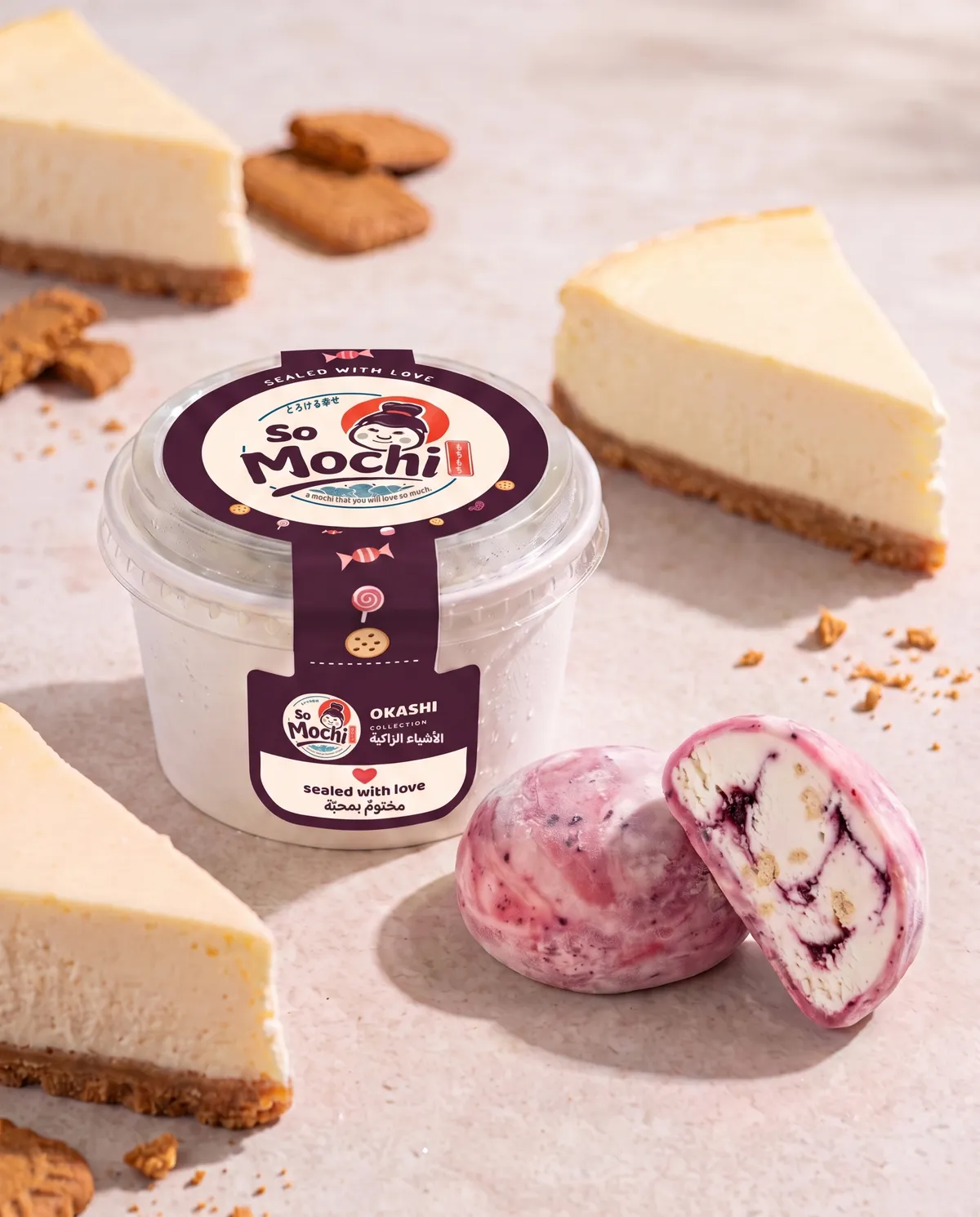 Jumbo Cheesecake mochi, whole and cut open, beside its sealed So Mochi cup