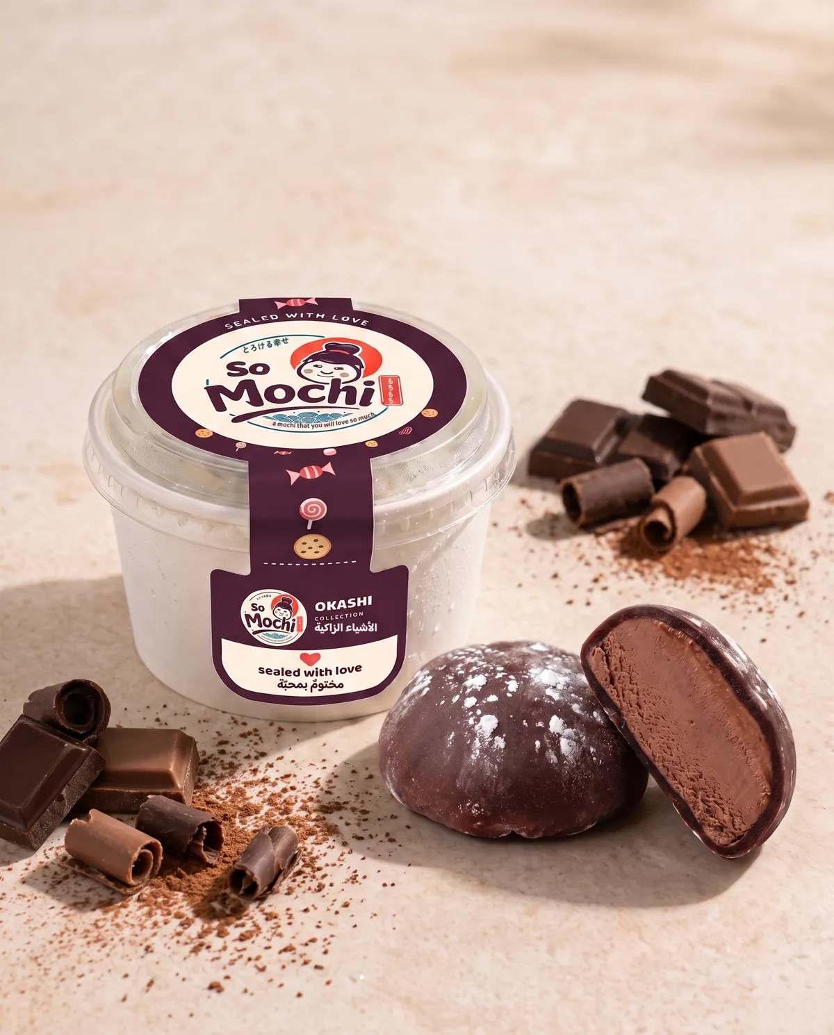 Jumbo Chocolate mochi, whole and cut open, beside its sealed So Mochi cup