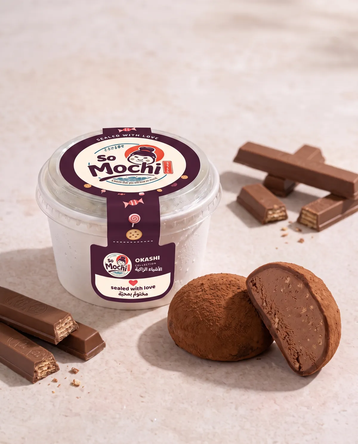 Jumbo KitKat mochi, whole and cut open, beside its sealed So Mochi cup