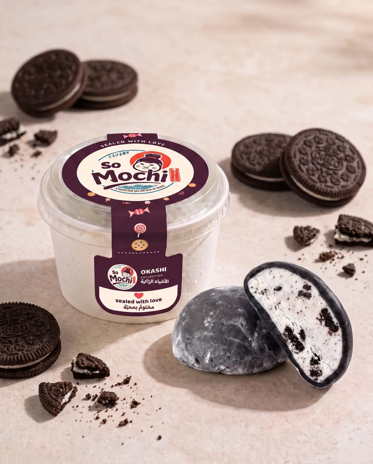 Jumbo Oreo mochi, whole and cut open, beside its sealed So Mochi cup