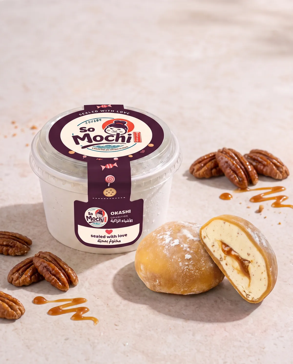 Jumbo Praline Pecan mochi, whole and cut open, beside its sealed So Mochi cup