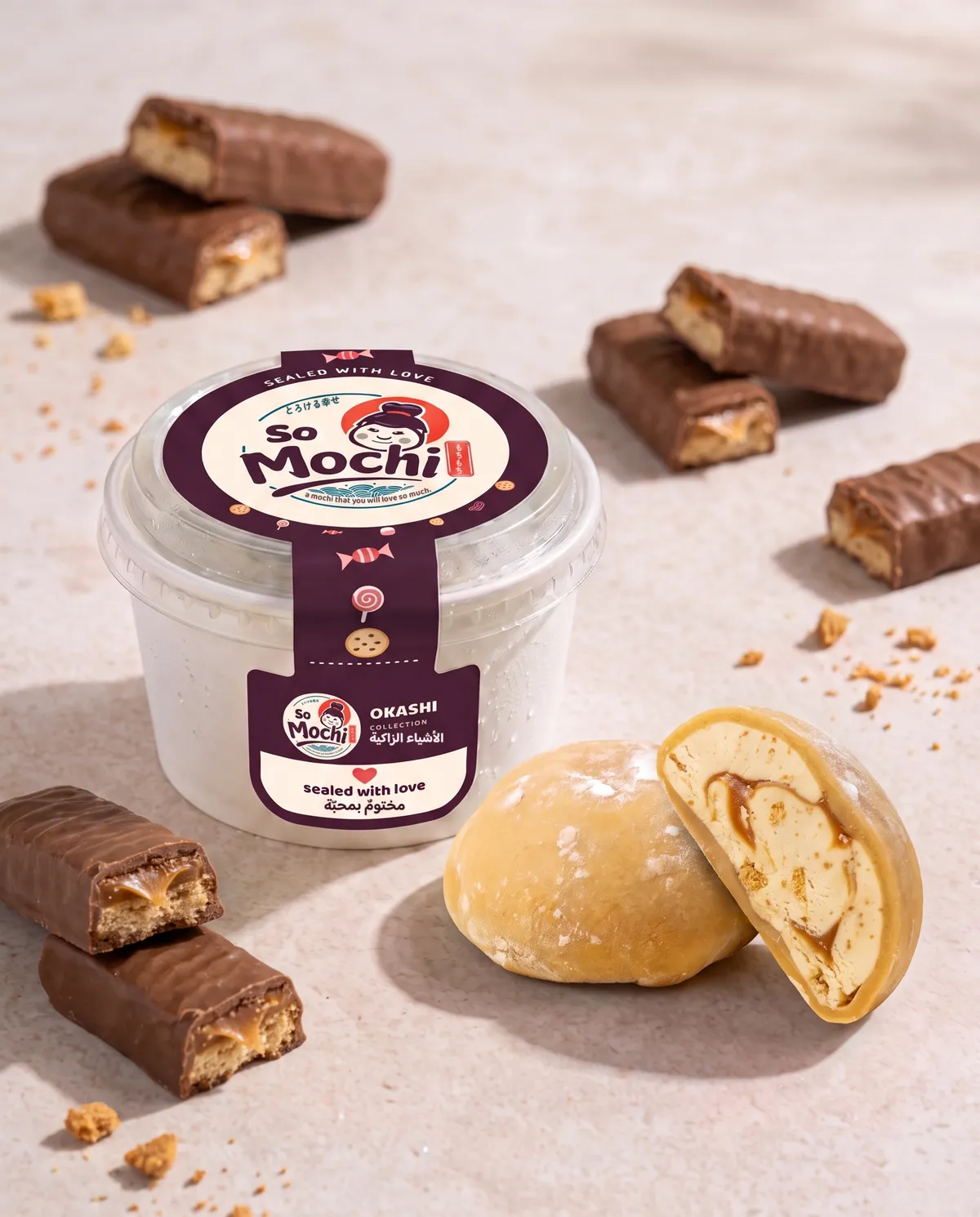 Jumbo Twix mochi, whole and cut open, beside its sealed So Mochi cup